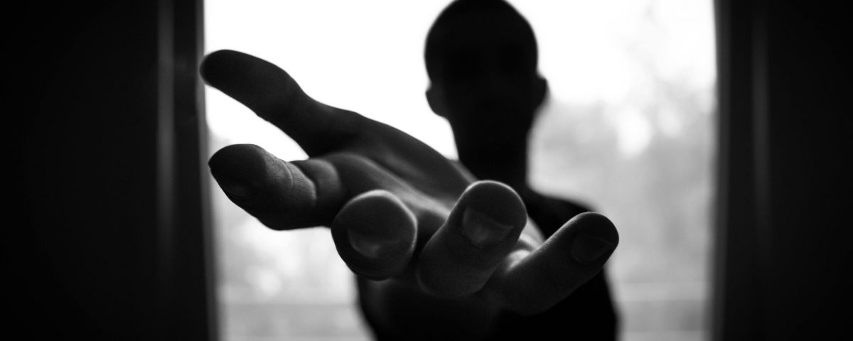 pexels-photo-167964-167964 Silhouette of a hand reaching out in a black and white contrast.